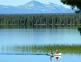 A young couple canoe on Nimpo Lake.